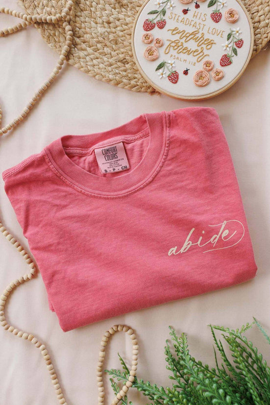 Back design of the His Steadfast Love Psalm 118 t-shirt — hand-lettered Scripture framed by florals, strawberries and needle-and-thread