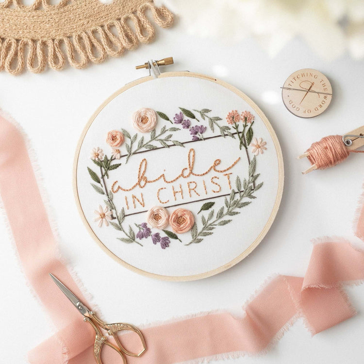 Abide in Christ floral wreath hoop with blush ribbon and gold scissors