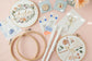 Everything in the Complete Embroidery Starter Kit laid out on a blush background