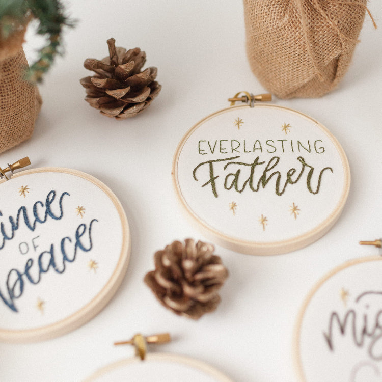 Close-up of the Everlasting Father ornament stitched in olive green