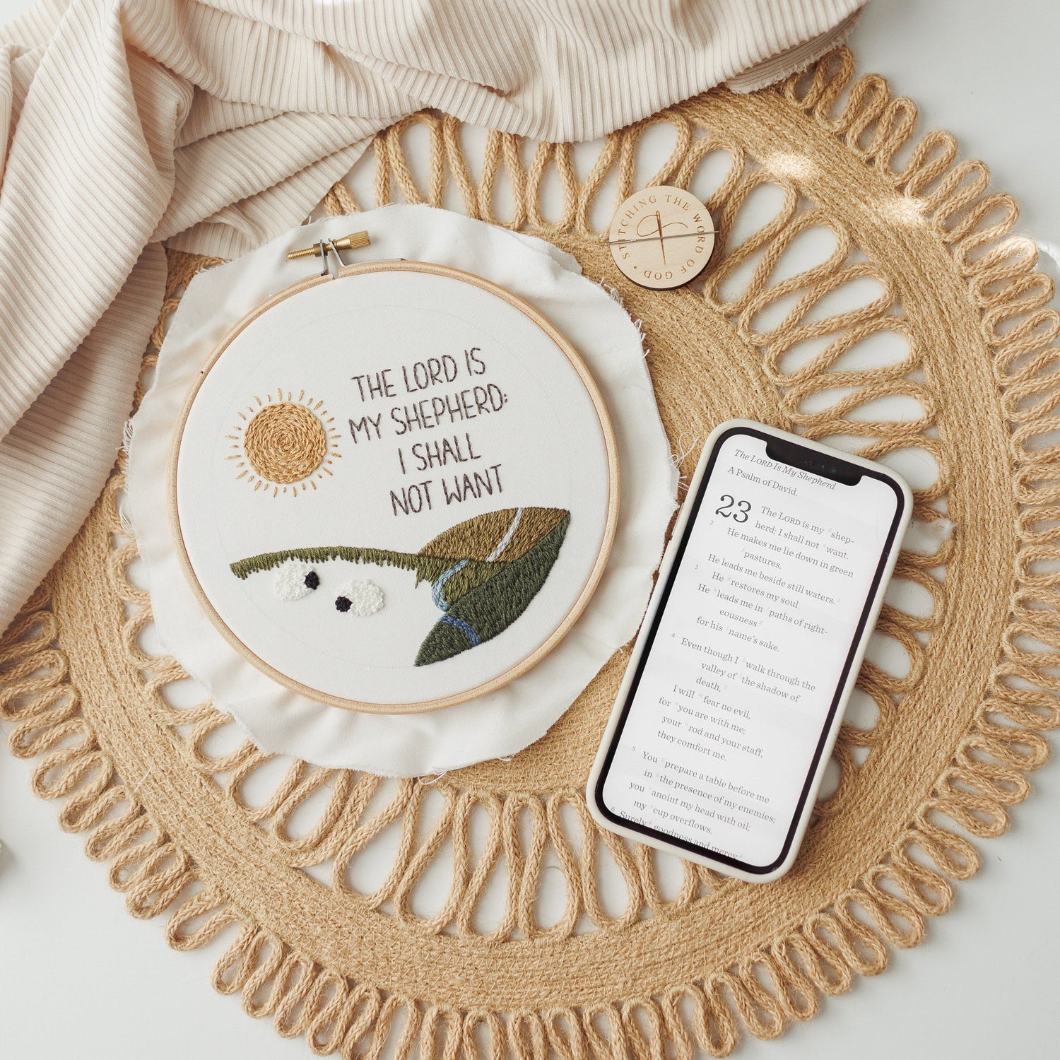 The Lord Is My Shepherd hoop beside a phone showing the video tutorial