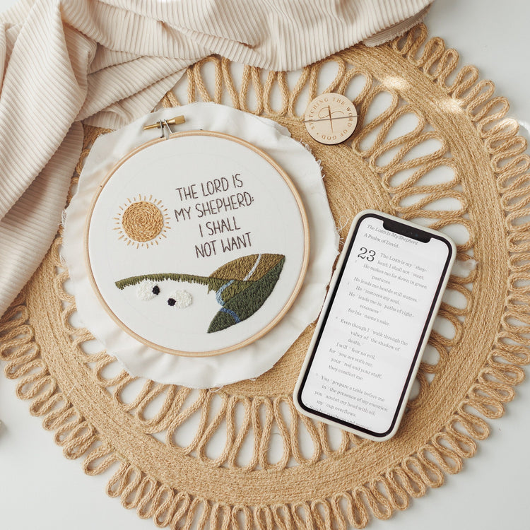 The Lord Is My Shepherd hoop beside a phone showing the video tutorial