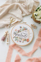 Him We Proclaim hoop styled with linen, brass and white florals