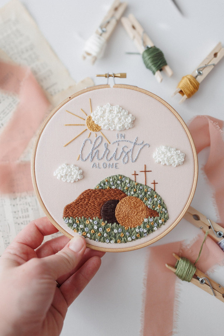 Hand holding the In Christ Alone hoop to show scale