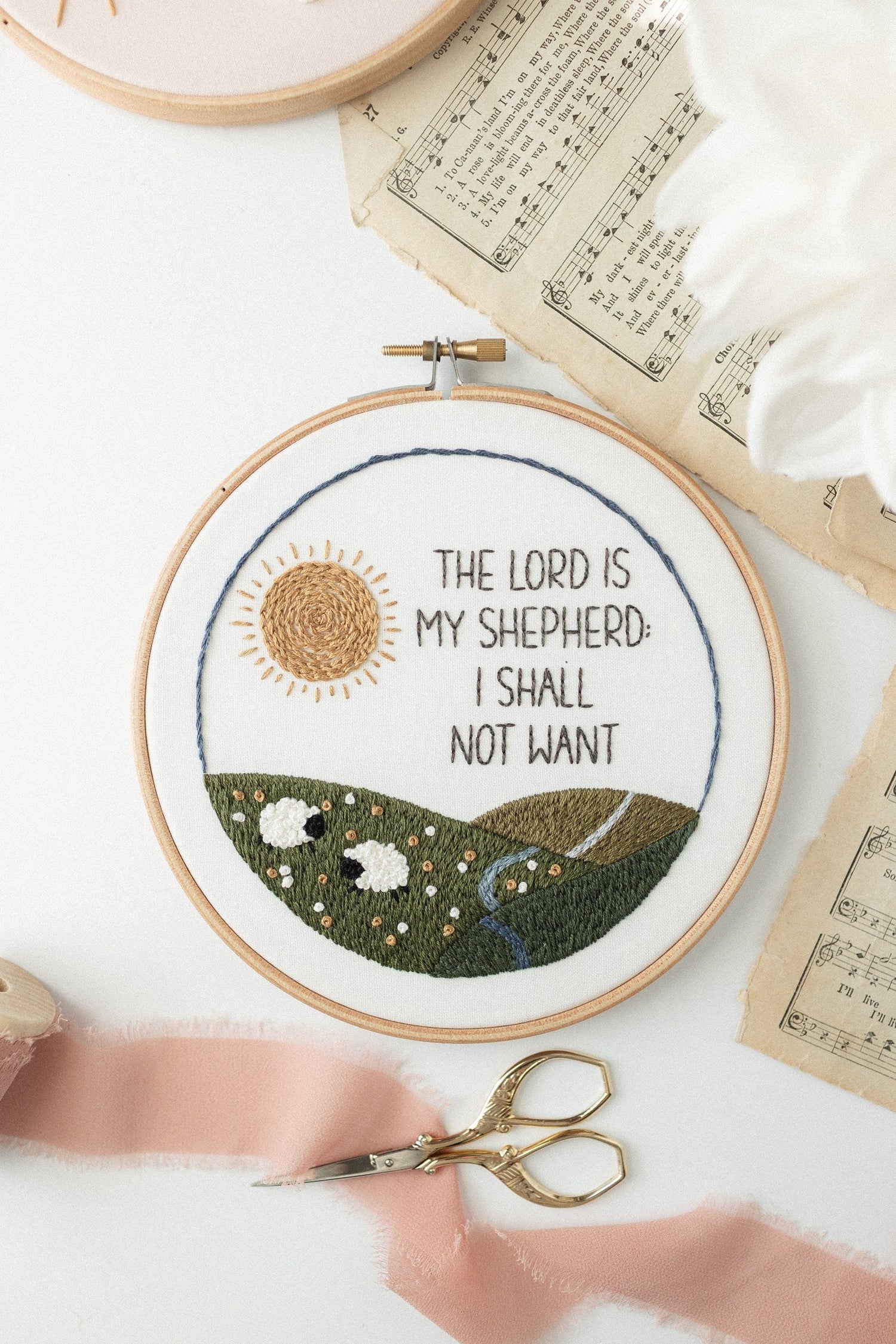 Psalm 23 embroidery hoop with blush ribbon and gold scissors