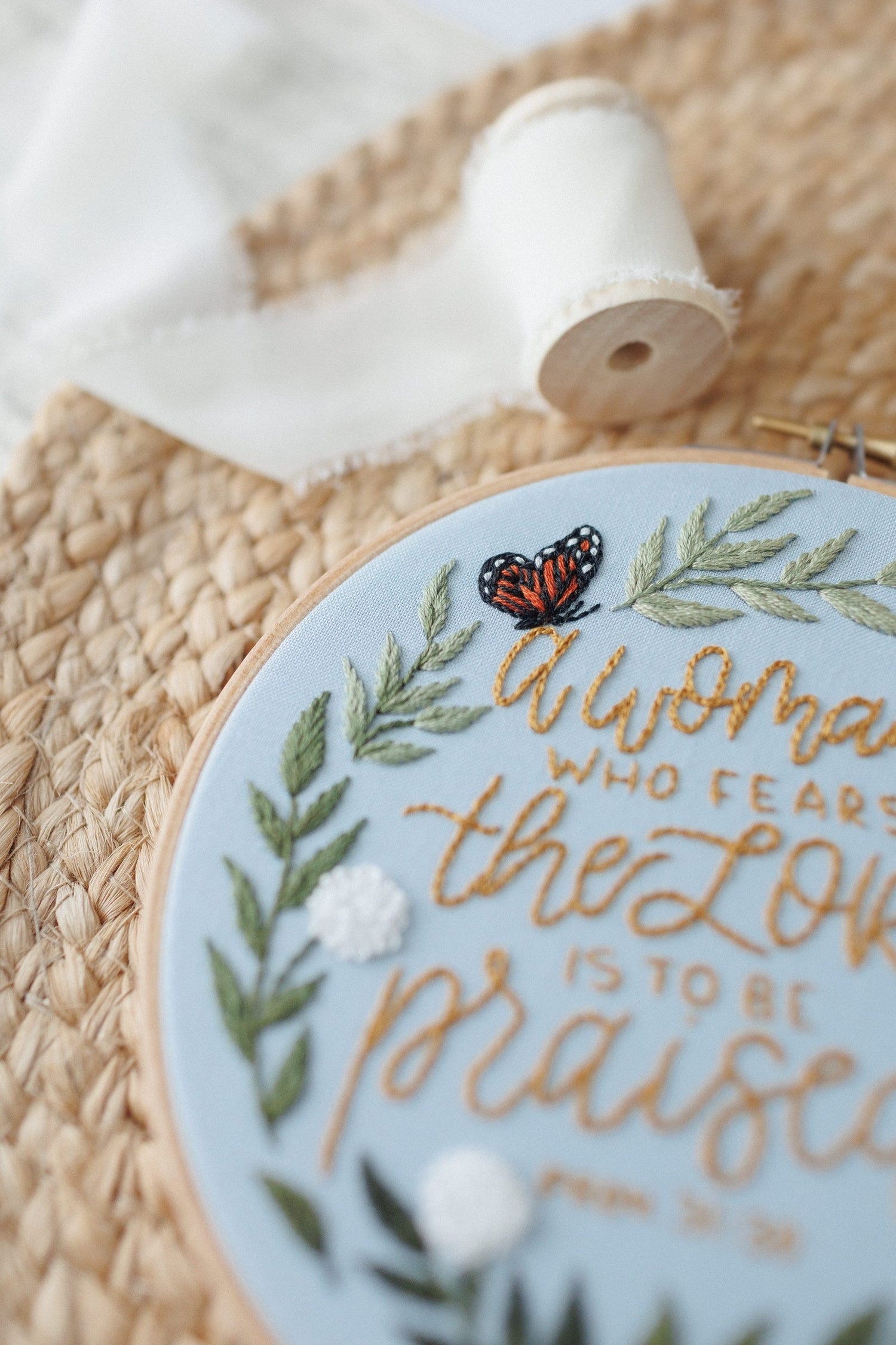 Close-up of the monarch butterfly and hand-lettering detail
