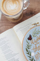 Proverbs 31 hoop beside an open Bible and a latte