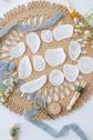 Taste and See stick and stitch designs laid out on a woven placemat
