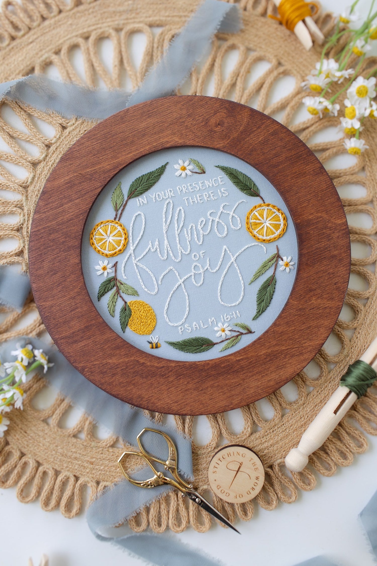 Finished Fullness of Joy piece displayed in a walnut hoop frame