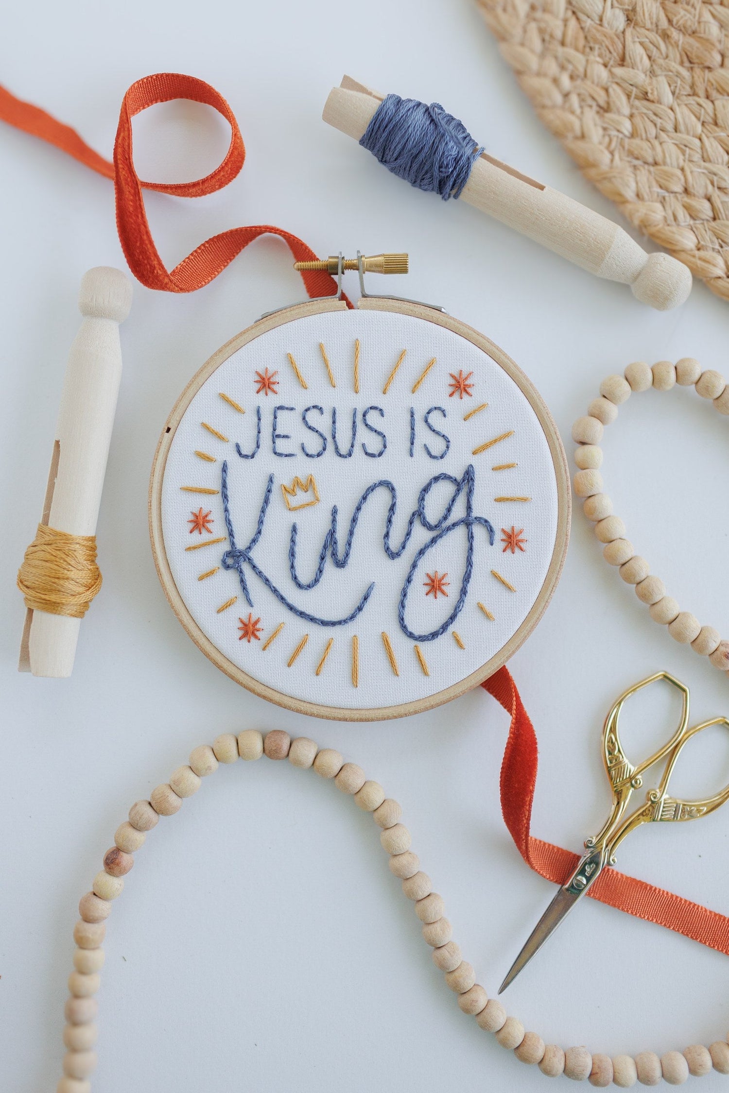 Jesus Is King kids embroidery hoop with red and blue floss