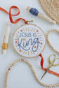 Jesus Is King kids embroidery hoop with red and blue floss