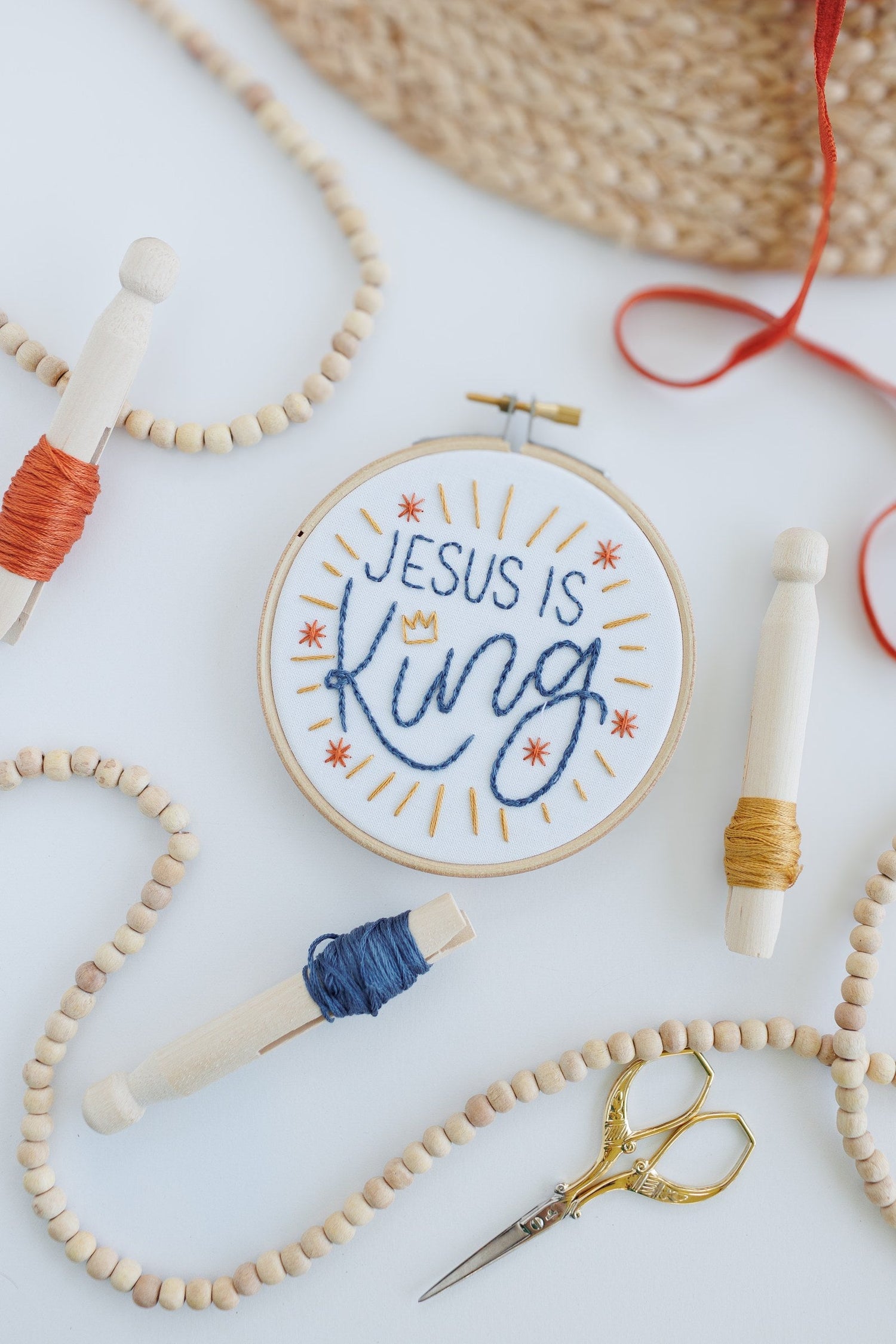 Jesus Is King hoop with wood beads and gold embroidery scissors