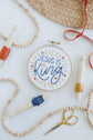 Jesus Is King hoop with wood beads and gold embroidery scissors