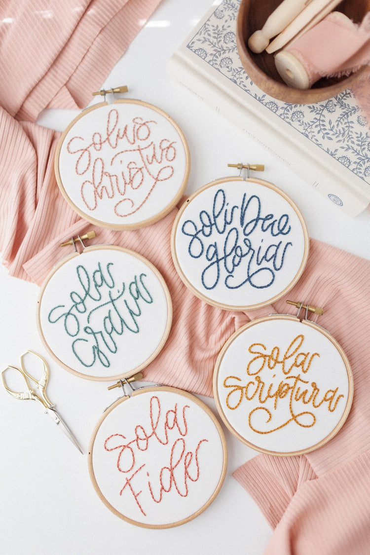 All five Solas embroidery hoops — Sola Scriptura, Fide, Gratia, Christus, Deo Gloria