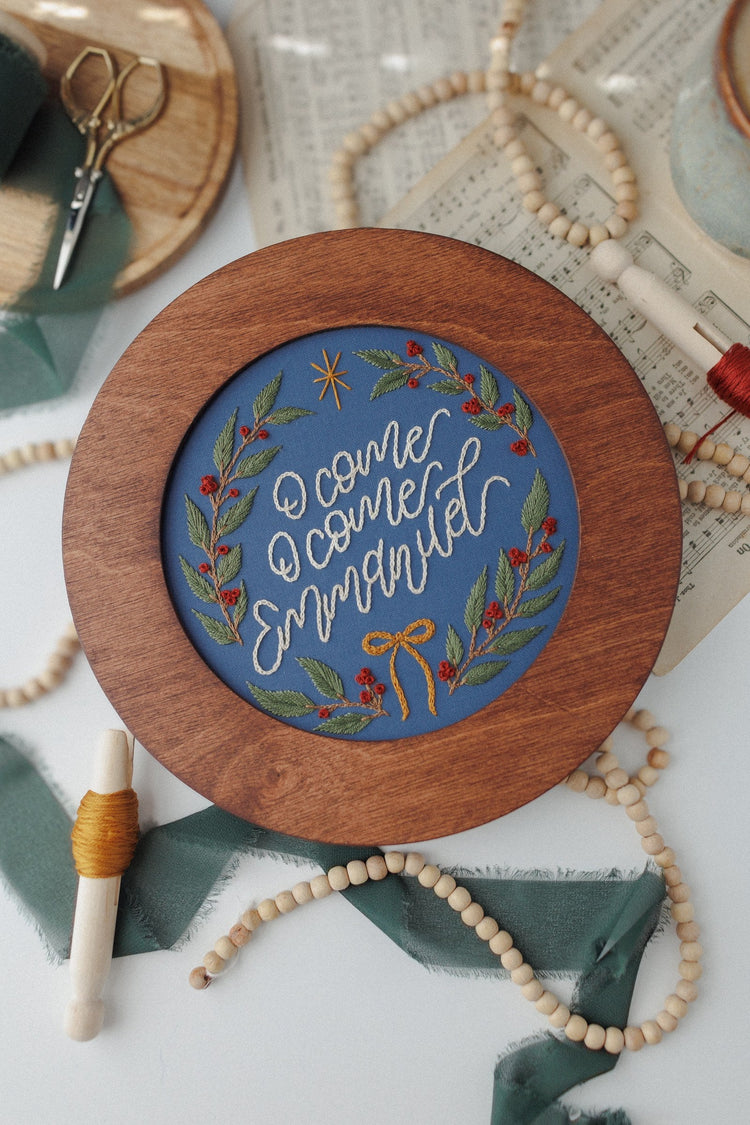 Finished Advent hoop displayed in a walnut hoop frame