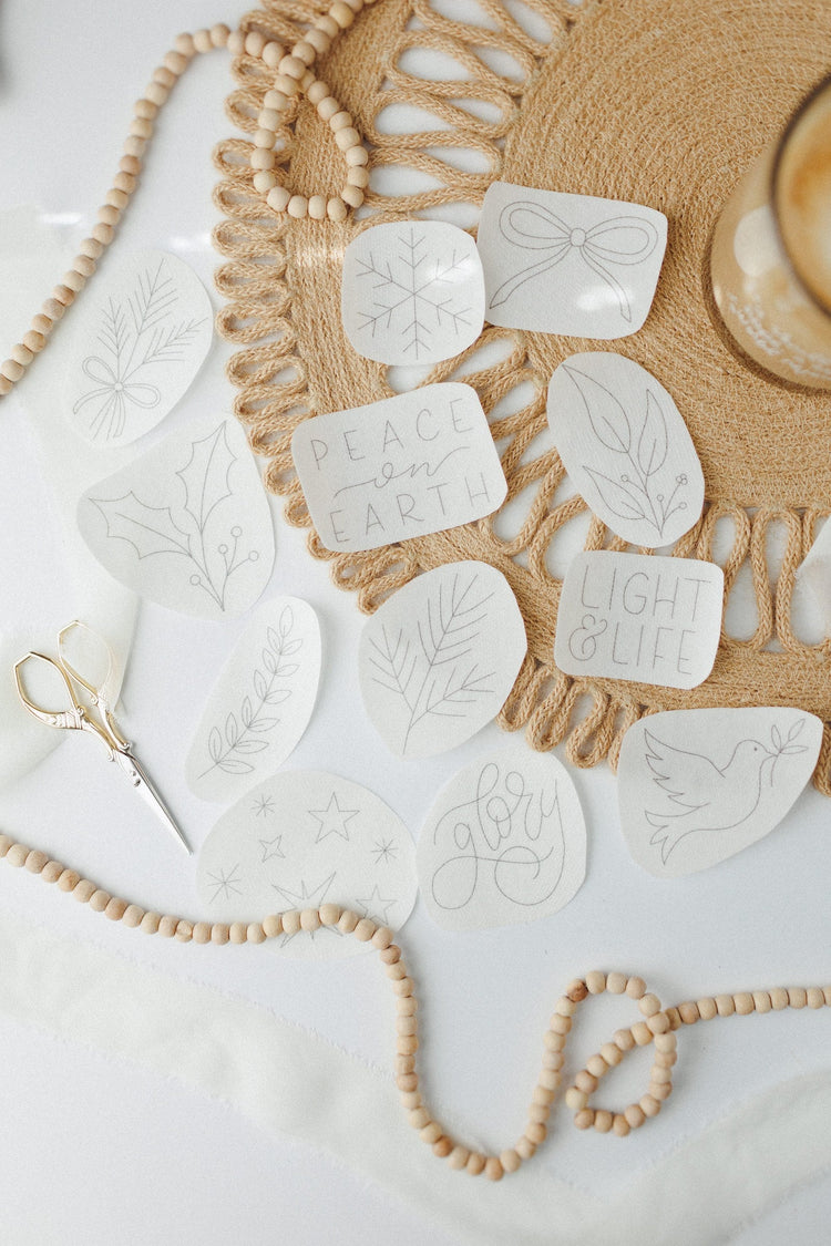 Peace on Earth stick and stitch design sheets laid out