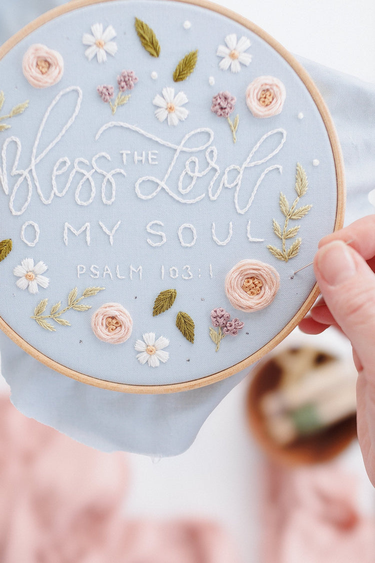 Hand holding the Bless the Lord O My Soul hoop to show scale