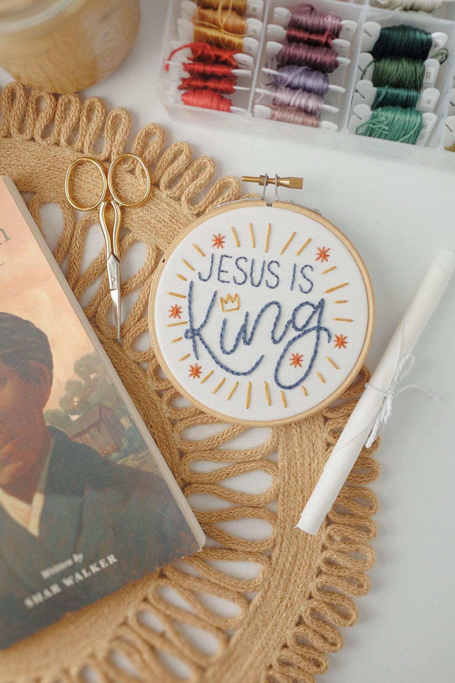 Jesus Is King hoop beside a children's book — Abide Kids